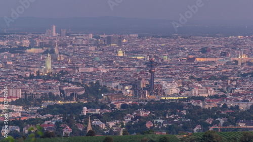 Skyline of Vienna from Danube Viewpoint Leopoldsberg aerial day to night timelapse. photo