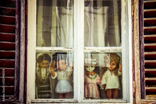 Wallpaper Mural Horror dolls over the window sill