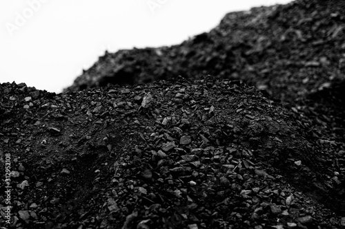 A heap of black natural coal, photo of coal mine background, texture