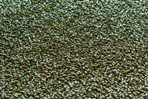 Obraz na płótnie Green polymer dye in granules, background texture