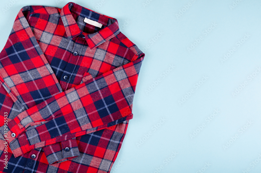Textile, shirt composition on color background. Flat lay.