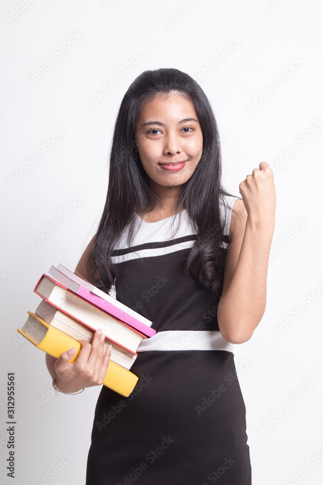 Young Asian woman studying with may books. Young Asian woman studying with may books.