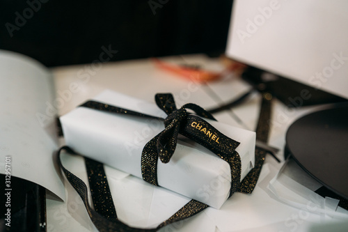 New York City, USA - January 02, 2020: Beautiful luxury Chanel gift with proper  packaging showing the brand on the ribbon. Perfect for Valentine day or  christmas. Stock Photo