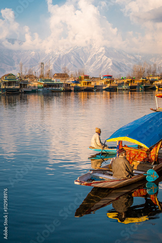 View of  Dal lake  and boat house before sunset in the heart of Srinagar during winter  , Srinagar , Kashmir , India photo