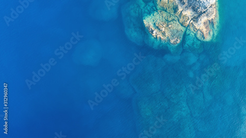 Aerial view of clear blue sea with rocks, beautiful nature background
