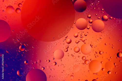 Oil drops on a water surface for modern and creation design background.