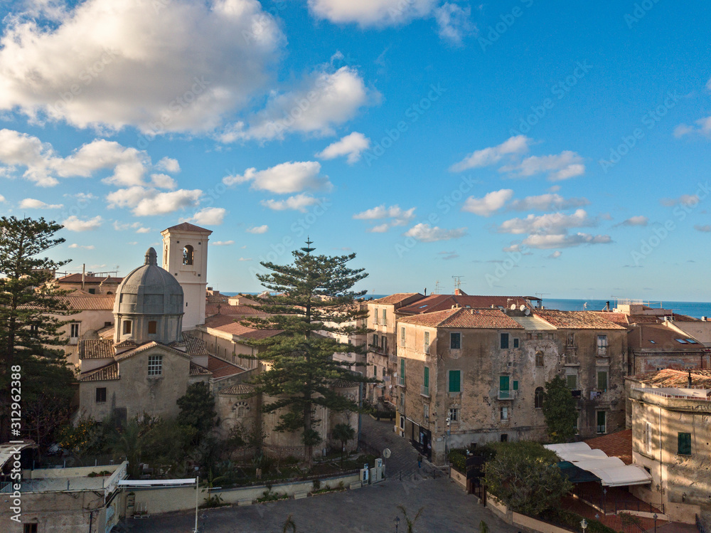 Aerial view of the cathedral, Cathedral of Maria Santissima of Romania. Roofs and houses of the city of Tropea, Calabria. Italy. 