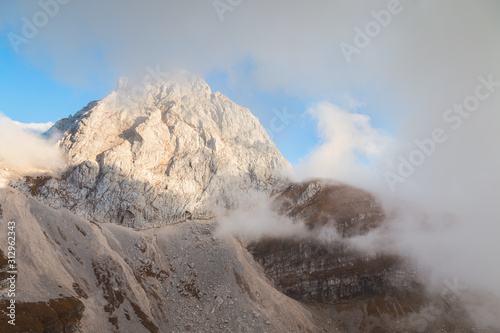 Mangart mountain in Slovenia covered in fog