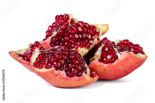Ripe pomegranate fruit with seeds isolated on white