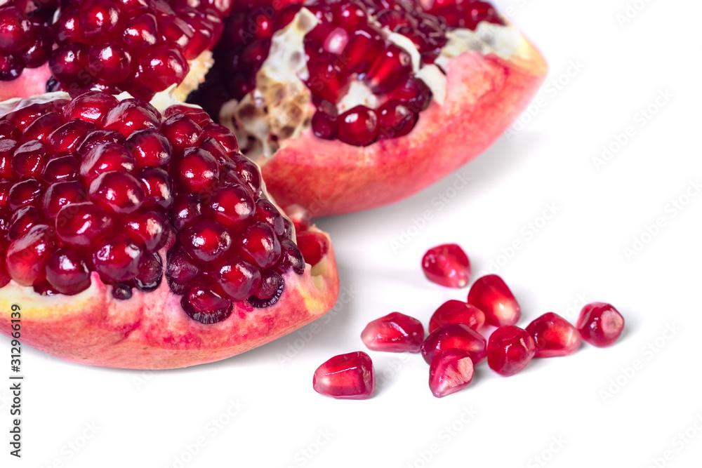 Ripe pomegranate fruit with seeds isolated on white Ripe pomegranate fruit with seeds isolated on white