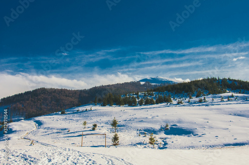 Fototapeta Naklejka Na Ścianę i Meble -  winter landscape with mountains and blue sky