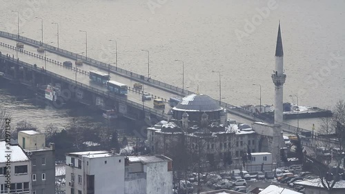 Unkapani bridge and Sokullu Mehmet Pasha Mosque in winter. Istanbul, Turkey photo