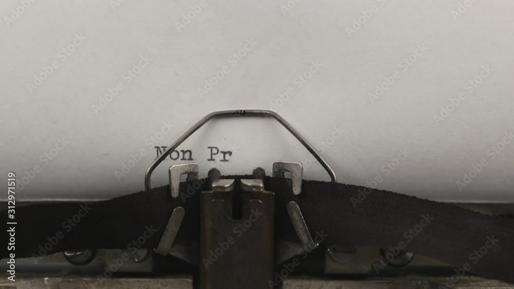 close-up typing a quote non profit, old vintage typewriter with a sheet of paper close-up typing a quote non profit, old vintage typewriter with a sheet of paper