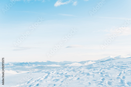 Photography Scenic view of snowy mountain with traces and pure blue sky