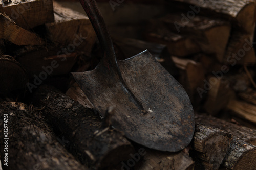 Wood Pile with a Shovel