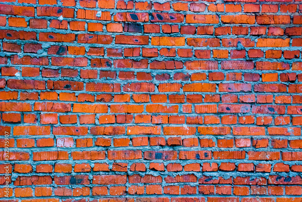 Fototapeta premium burnt brick brick wall.