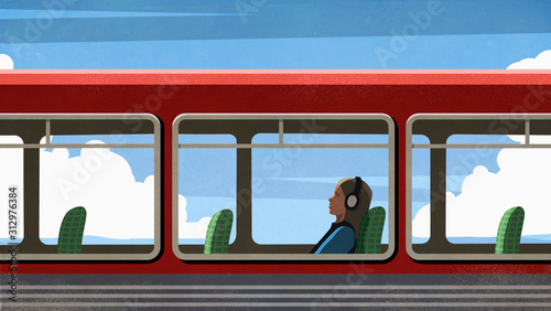 Female commuter relaxing, listening to music with headphones on bus