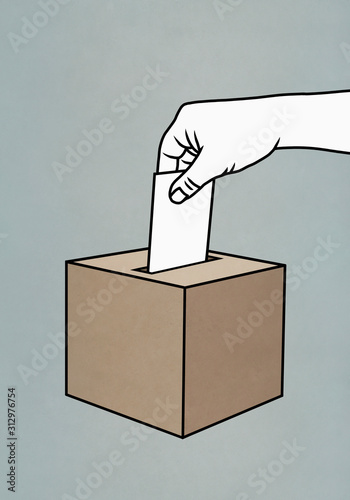 Hand placing ballot in box