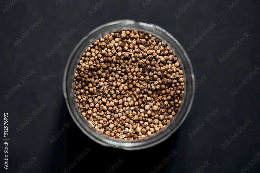 View from above cilantro seeds in spice jar View from above cilantro seeds in spice jar