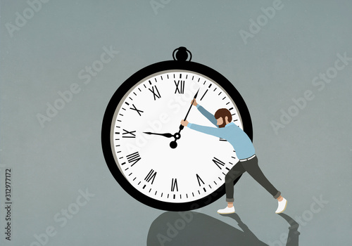 Man pushing hands of large stopwatch