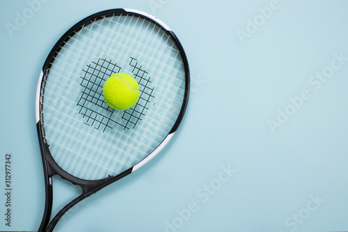 Tennis ball and racket isolated background. Top view © mertkantekin