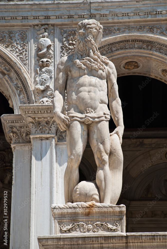 Venice, Italy: A statue of Neptune - the Roman God of the Sea, located at the Giants Staircase at the Doges Palace (Palazzo Ducale). The statue represents Venice’s power by sea