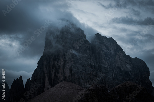 Canvas Print dark mountains and heavy clouds