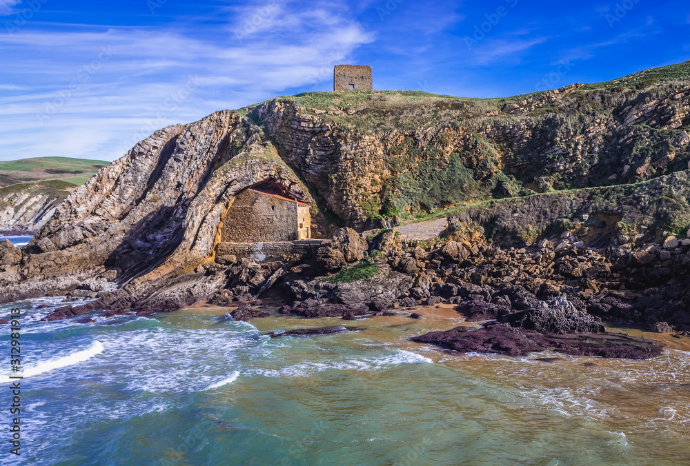 House in the rocks - small hermitage on Santa Justa beach near Ubiarco town, Spain
