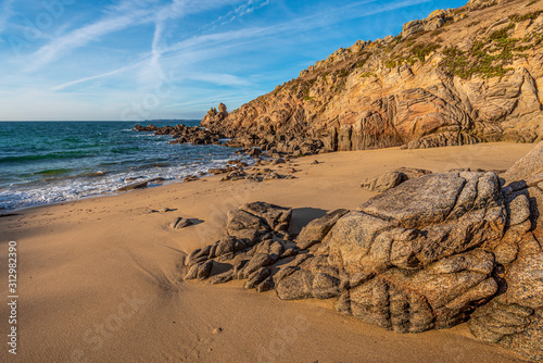 Fototapeta Naklejka Na Ścianę i Meble -  Granit rocks and yellowish send of southwestern coastline of Houat island in French Brittany.