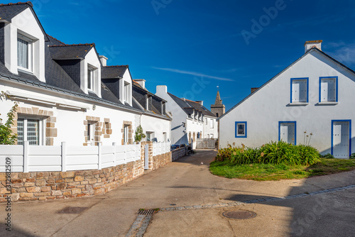 Typical houses in the village of Houat island in French Brittany. The top of Saint Gildas church is at background. © sasha64f