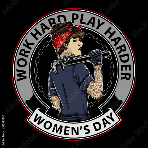 tattooed woman with rockabilly mechanic style holding a wrench, with chain and flame circle background
