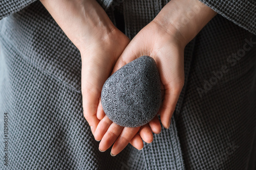 Natural konjac sponge in a female hands, healthy lifestyle. photo