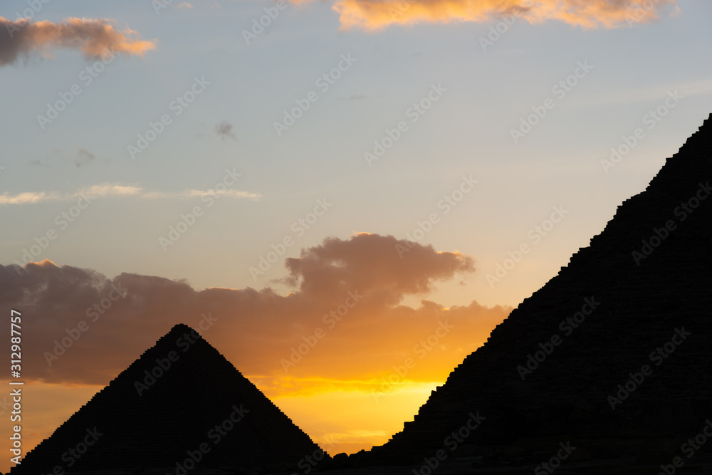Sunset behind Giza pyramids