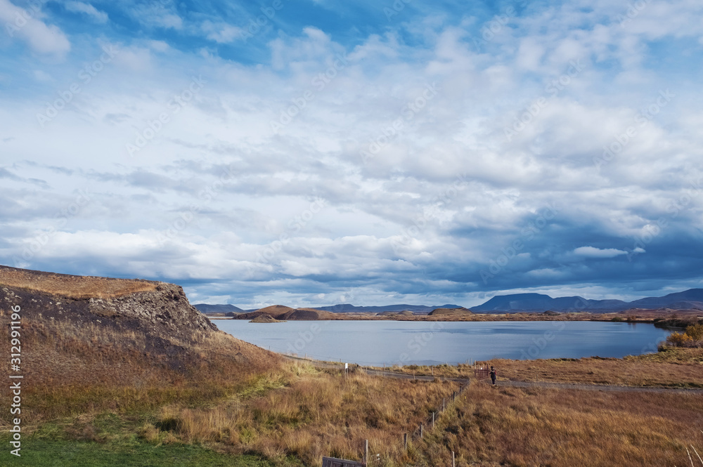 The lake of Myvatn is surrounded by mountains with a beautiful sky The lake of Myvatn is surrounded by mountains with a beautiful sky