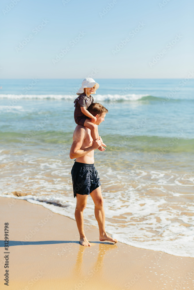 Father with daughter on beach Father with daughter on beach