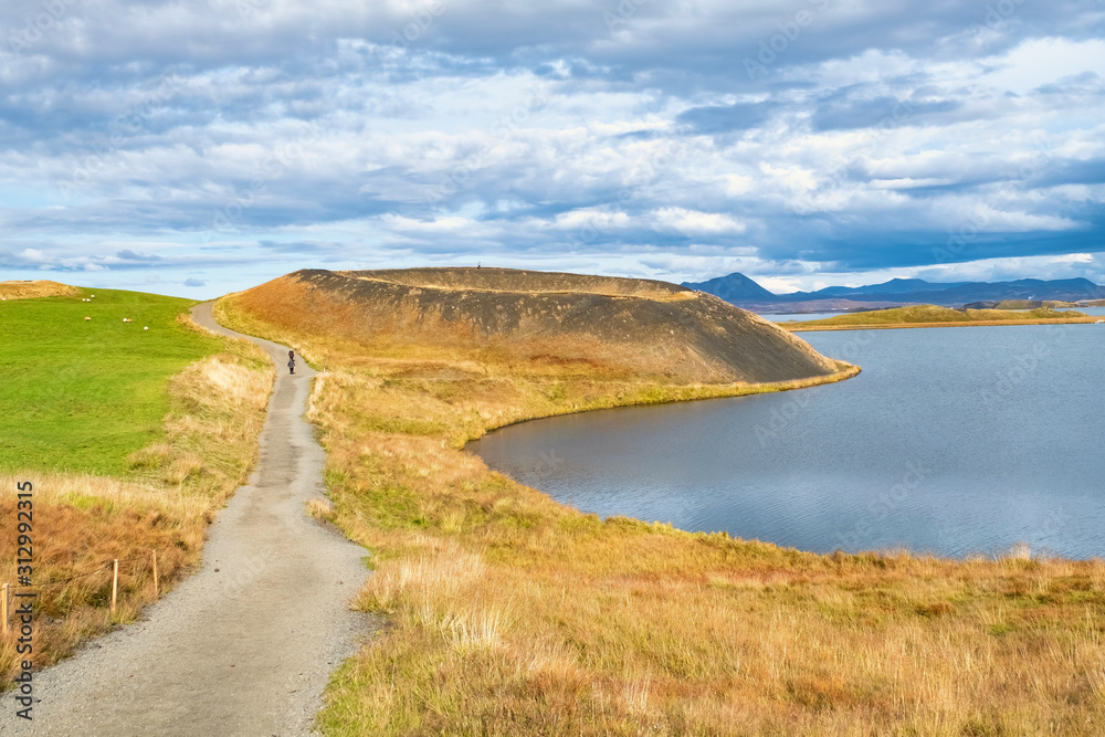 Idyllic landscape in soft colors, blue, green and yellow, Lake Mývatn in autumn colors, Iceland 