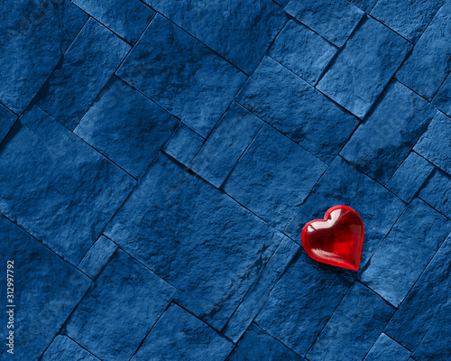 A red heart against a blue stone. Valentine's day photo