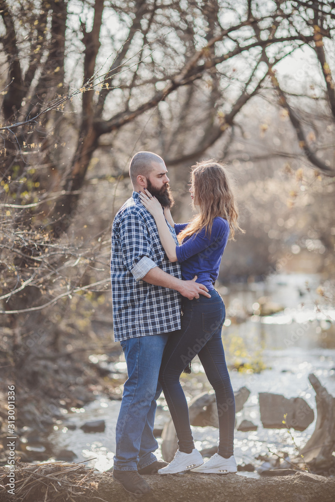 Hipster couple, girl with red hair and shaved bearded man Hipster couple, girl with red hair and shaved bearded man