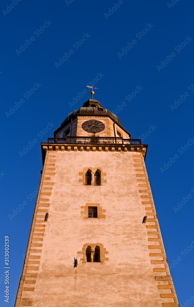Altenburg / Germany: Romanesque St. Nikolai church tower in the heart of the historic Nikolai quarter in the deep winter sun