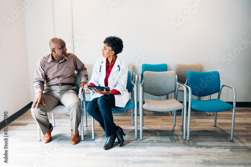 Doctor consulting  mature medical patient