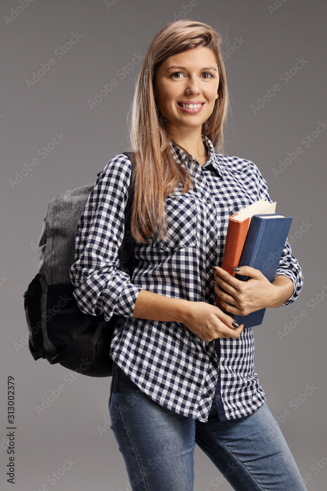 Female student with books and backpack Female student with books and backpack