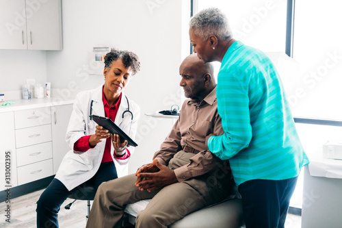 Doctor consulting mature patient