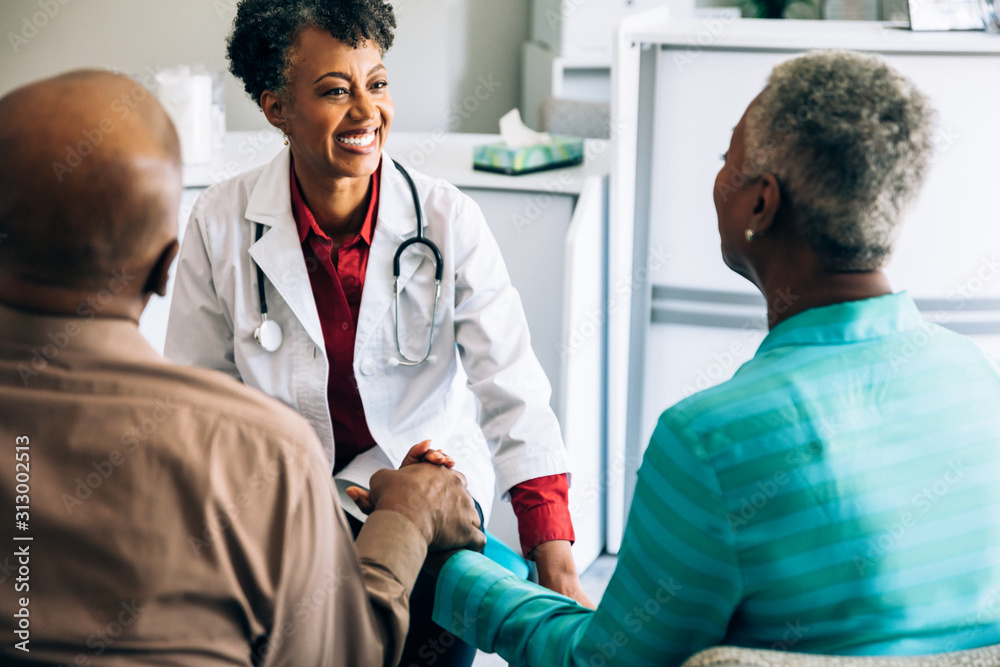 Doctor consulting mature couple Doctor consulting mature couple