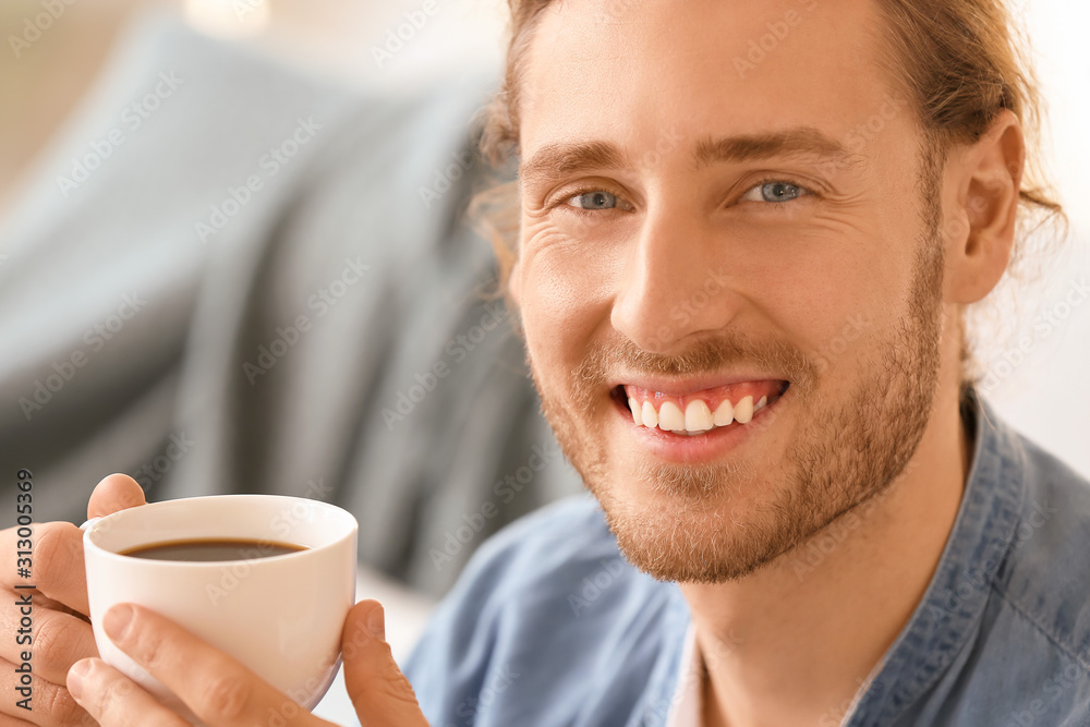 Handsome man drinking coffee at home Handsome man drinking coffee at home