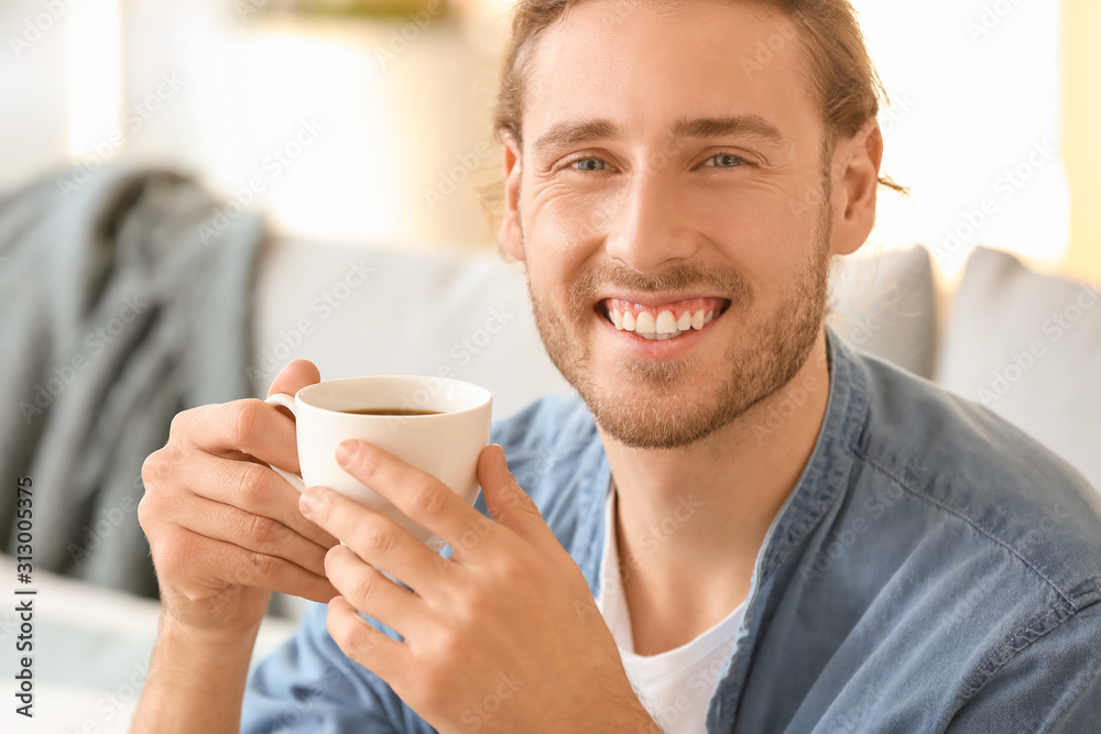 Handsome man drinking coffee at home Handsome man drinking coffee at home