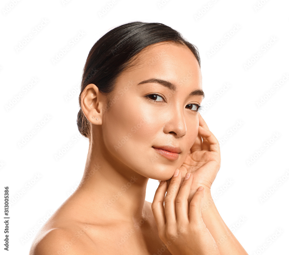 Portrait of young Asian woman with healthy skin on white background