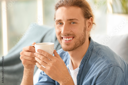 Handsome man drinking coffe...