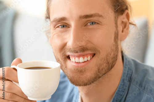Handsome man drinking coffe...