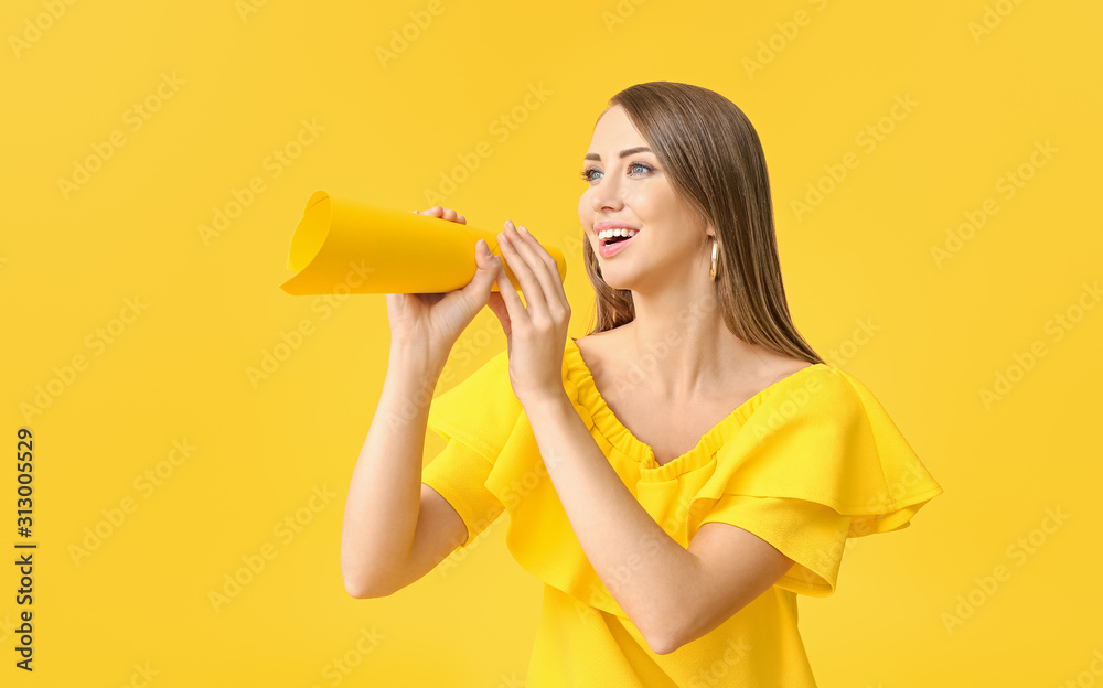 Young woman with paper megaphone on color background Young woman with paper megaphone on color background