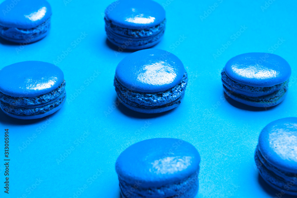 Blue macarons on color background Blue macarons on color background